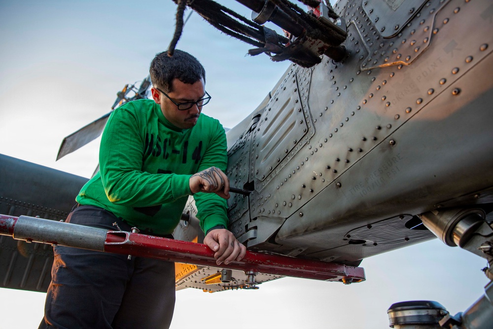 Abraham Lincoln conducts routine aircraft maintenance