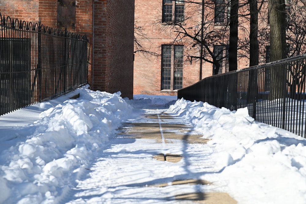 Personnel Clear Walkways Following Washington Navy Yard Snowfall