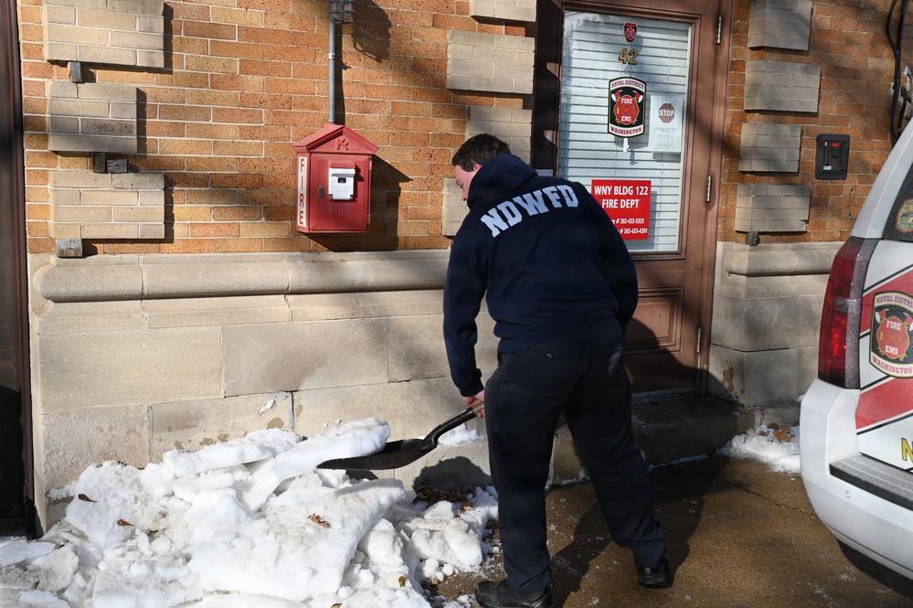 NDW Firefighters Clear Facility Entrances After Snowstorm