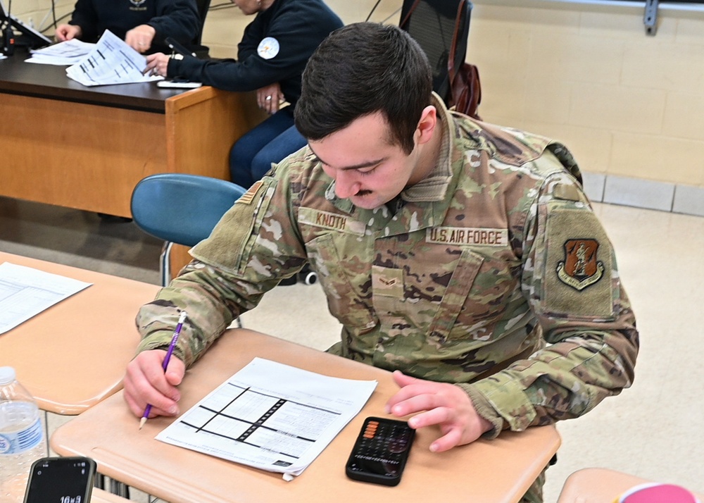 104th Fighter Wing volunteers with JROTC at Regional drill competition