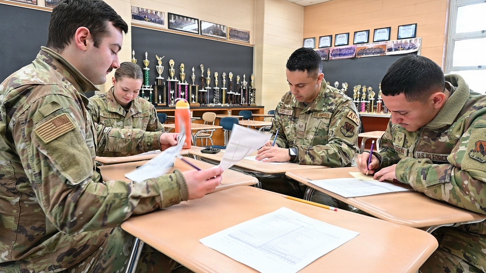 104th Fighter Wing volunteers with JROTC at Regional drill competition