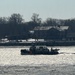 The Coast Guard Cutter Hawser successfully broke ice and freed the NYPD Harbor David after the vessel became beset.