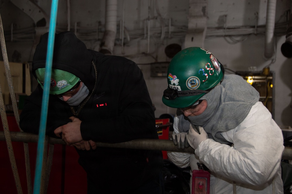 Ronald Reagan Sailors and Contractors Perform Maintenance