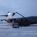 176th AMXS Guardsmen deice a C-17 Globemaster III