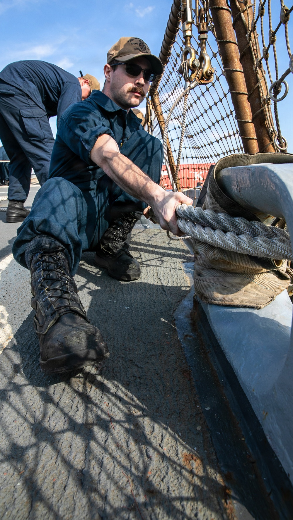 USS Mitscher (DDG 57) Sailor secures mooring line during sea and anchor