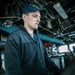 USS Mitscher (DDG 57) junior officer stands watch in ship bridge