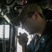 USS Mitscher (DDG 57) Sailor speaks on 1MC in ship bridge
