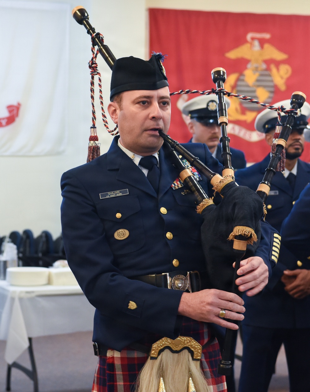 Coastguardsman Plays Bagpipes at 46th Coast Guard Cutter Blackthorn Memorial
