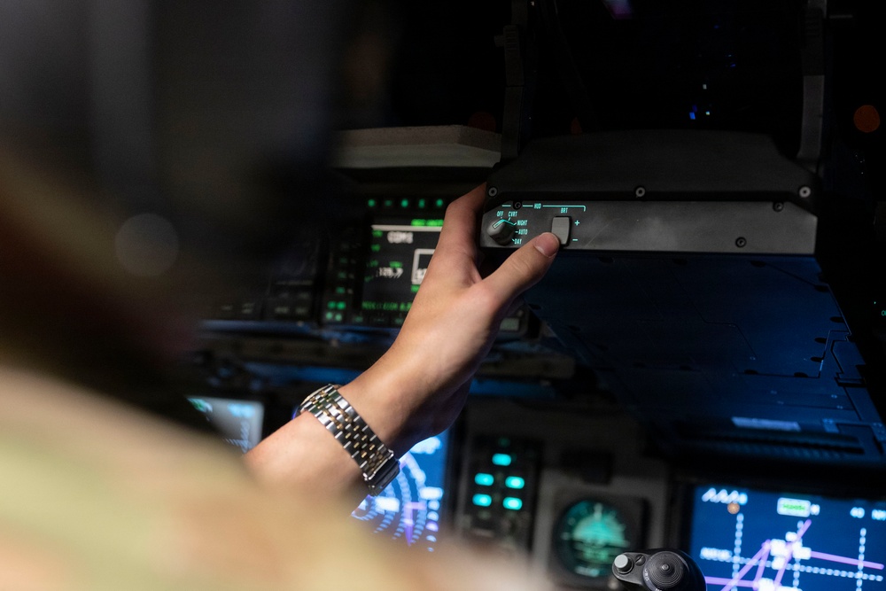 The 14th Airlift Squadron conducts a nighttime dissimular formation flight during Exercise Palmetto Reach