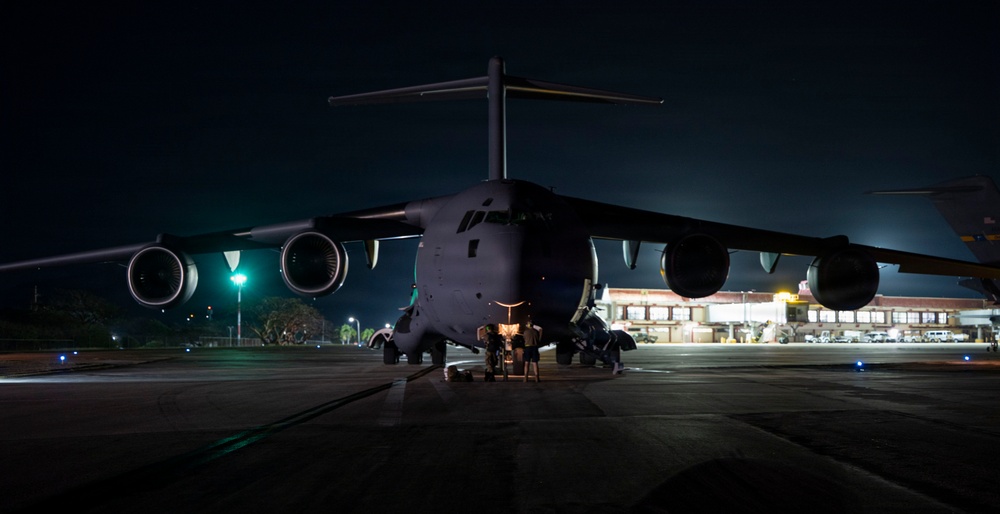 The 14th Airlift Squadron conducts a nighttime dissimular formation flight during Exercise Palmetto Reach