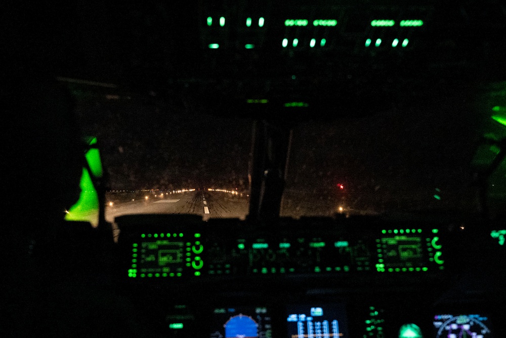 The 14th Airlift Squadron conducts a nighttime dissimular formation flight during Exercise Palmetto Reach