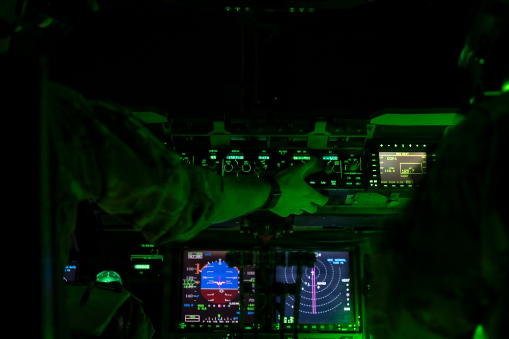 The 14th Airlift Squadron conducts a nighttime dissimular formation flight during Exercise Palmetto Reach
