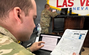 Maintainer reviews digital maintenance binder