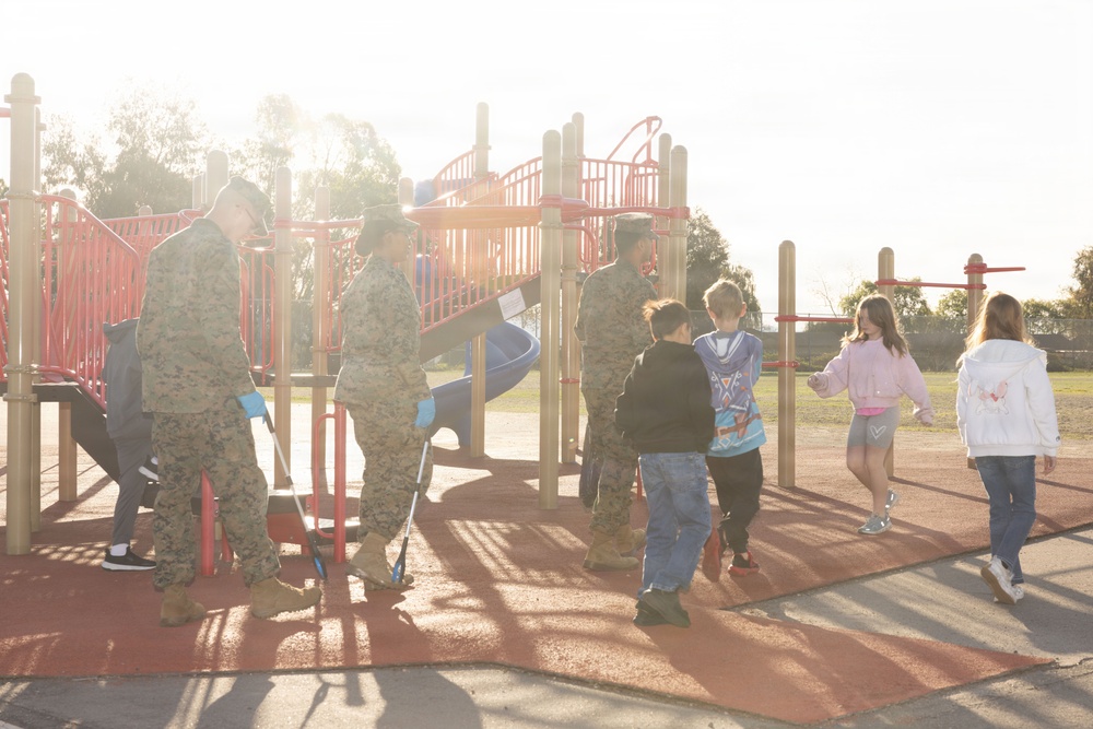 Marines and Sailors with MWHS-3 conduct a Campus clean-up at Doris Miller Elementary School