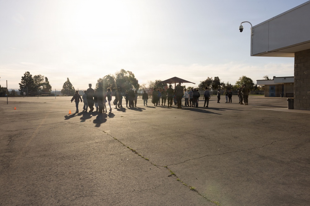 Marines and Sailors with MWHS-3 conduct a Campus clean-up at Doris Miller Elementary School