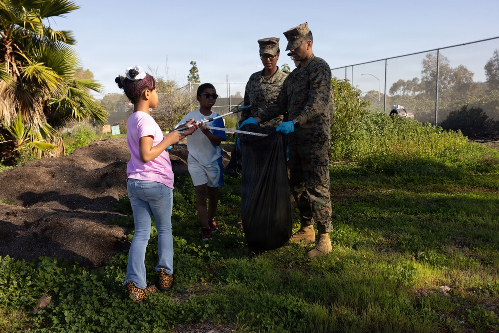 Marines and Sailors with MWHS-3 conduct a Campus clean-up at Doris Miller Elementary School
