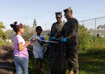 Marines and Sailors with MWHS-3 conduct a Campus clean-up at Doris Miller Elementary School