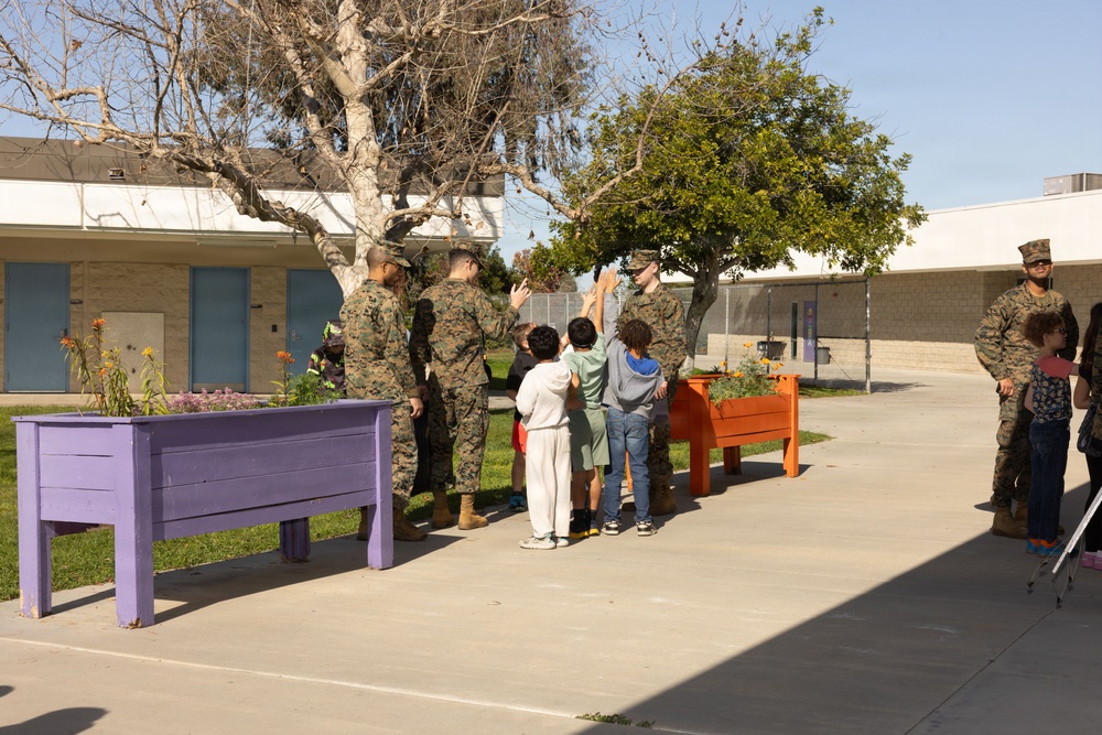 Marines and Sailors with MWHS-3 conduct a Campus clean-up at Doris Miller Elementary School