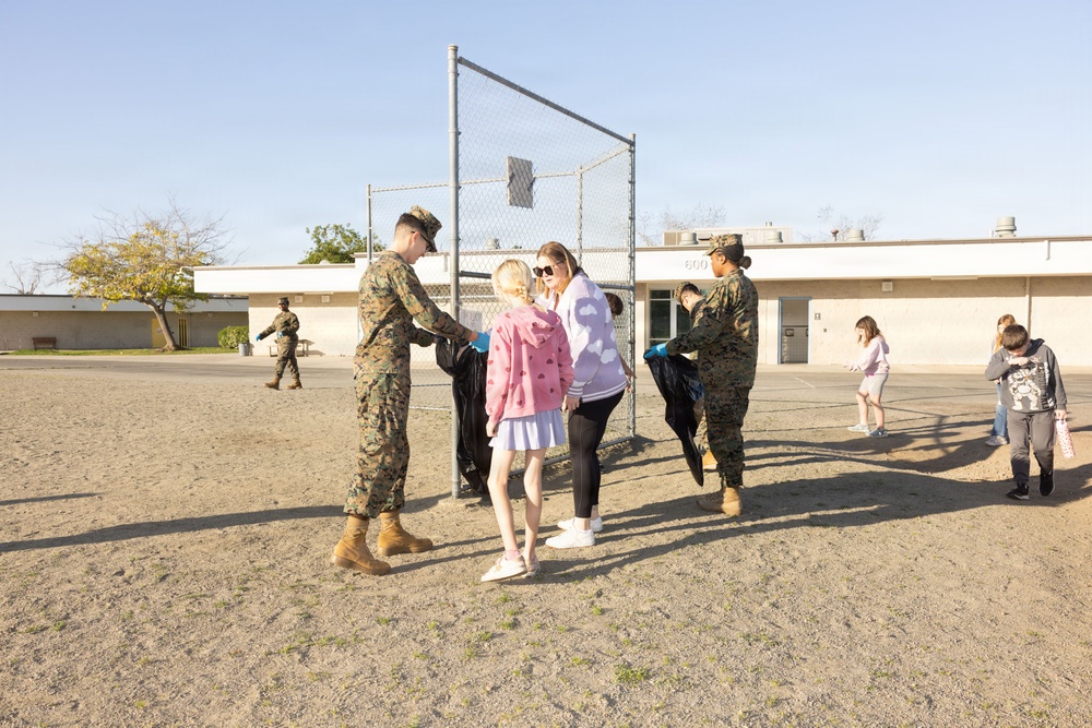 Marines and Sailors with MWHS-3 conduct a Campus clean-up at Doris Miller Elementary School