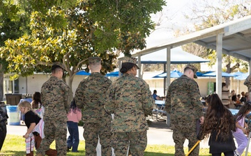 Marines and Sailors with MWHS-3 conduct a Campus clean-up at Doris Miller Elementary School