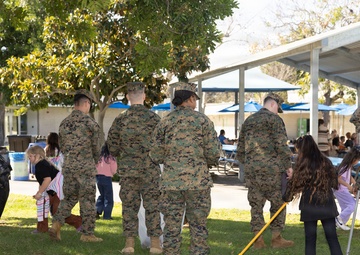 Marines and Sailors with MWHS-3 conduct a Campus clean-up at Doris Miller Elementary School