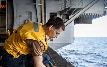 Abraham Lincoln conducts routine maintenance