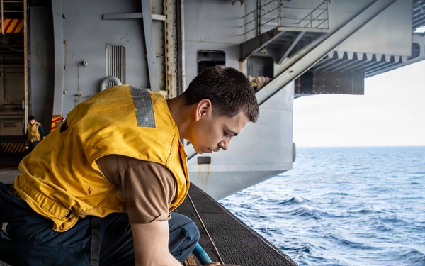 Abraham Lincoln conducts routine maintenance