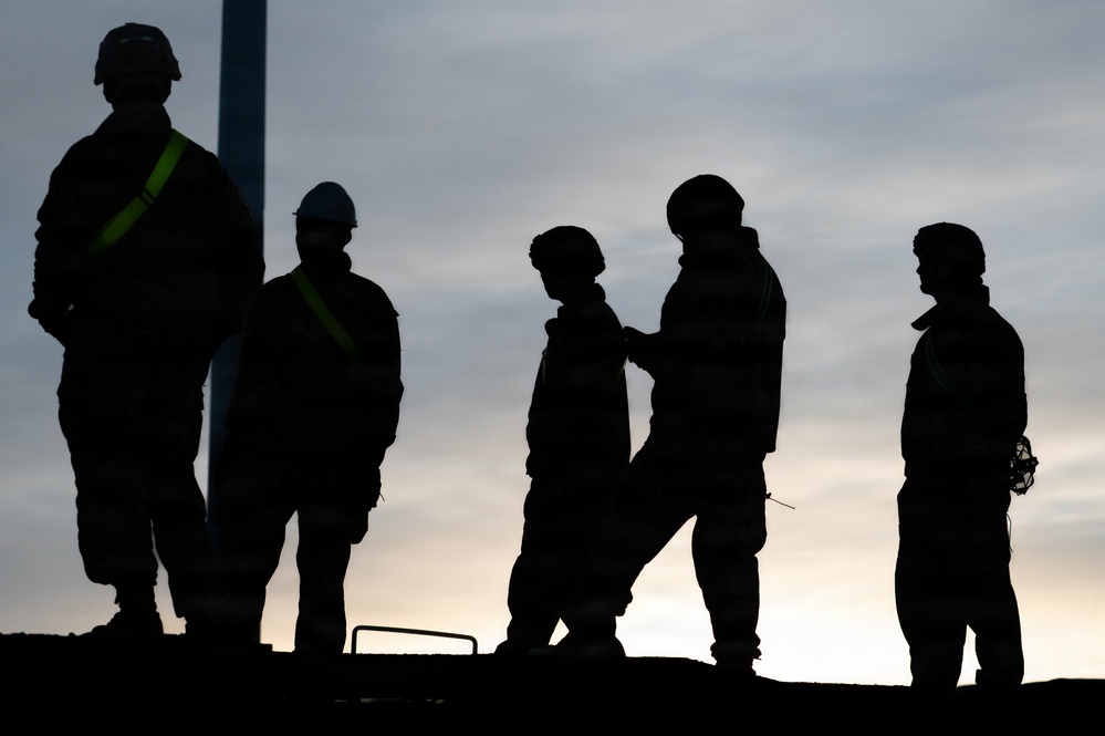 Soldiers load freight in preparation for JPMRC 26-02