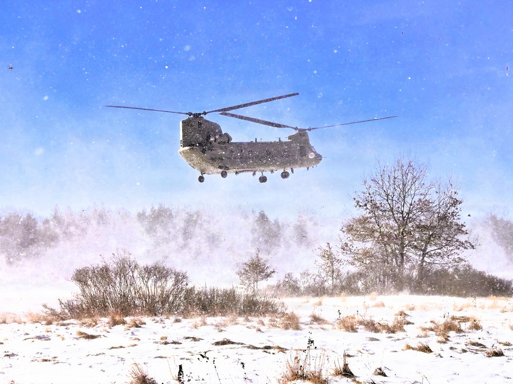 120th Field Artillery Soldiers conduct winter sling-load ops with Black Hawk, Chinook helicopters