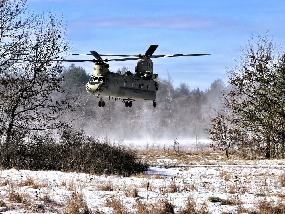 120th Field Artillery Soldiers conduct winter sling-load ops with Black Hawk, Chinook helicopters