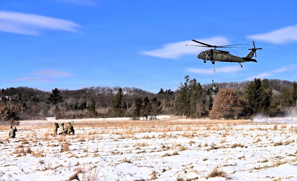 120th Field Artillery Soldiers conduct winter sling-load ops with Black Hawk, Chinook helicopters