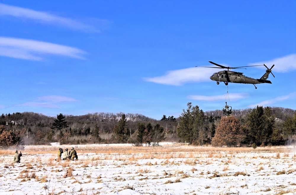 120th Field Artillery Soldiers conduct winter sling-load ops with Black Hawk, Chinook helicopters