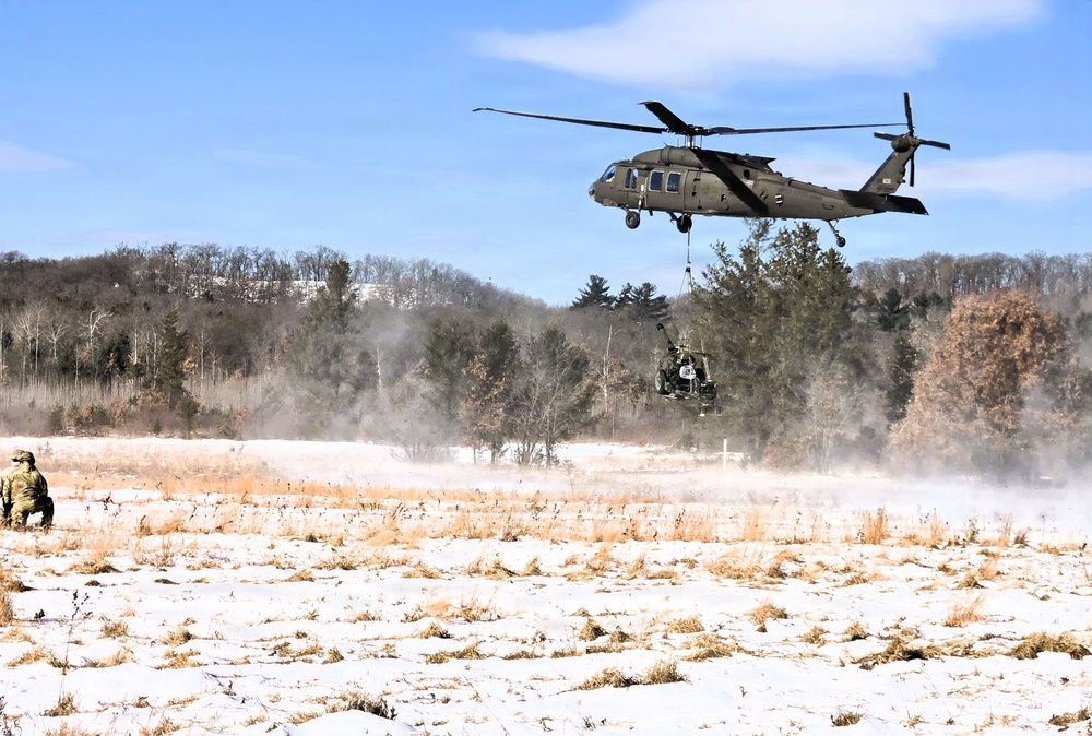 120th Field Artillery Soldiers conduct winter sling-load ops with Black Hawk, Chinook helicopters