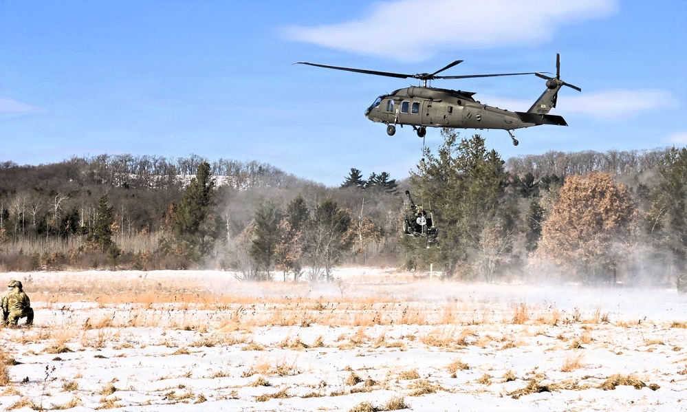 120th Field Artillery Soldiers conduct winter sling-load ops with Black Hawk, Chinook helicopters