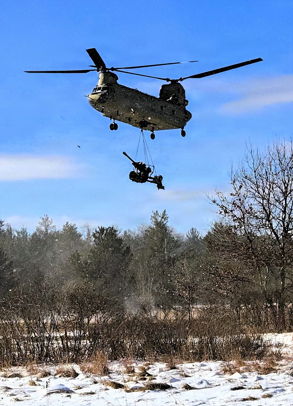 120th Field Artillery Soldiers conduct winter sling-load ops with Black Hawk, Chinook helicopters