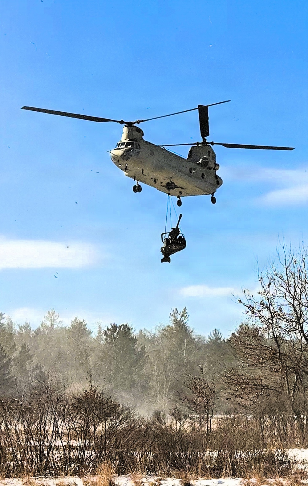 120th Field Artillery Soldiers conduct winter sling-load ops with Black Hawk, Chinook helicopters