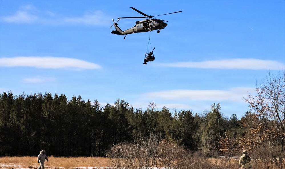 120th Field Artillery Soldiers conduct winter sling-load ops with Black Hawk, Chinook helicopters