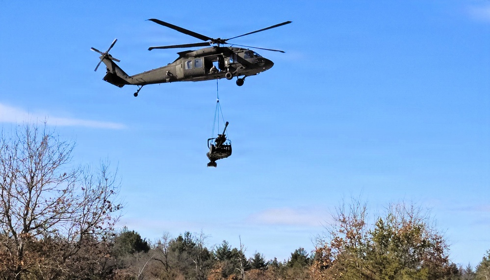 120th Field Artillery Soldiers conduct winter sling-load ops with Black Hawk, Chinook helicopters