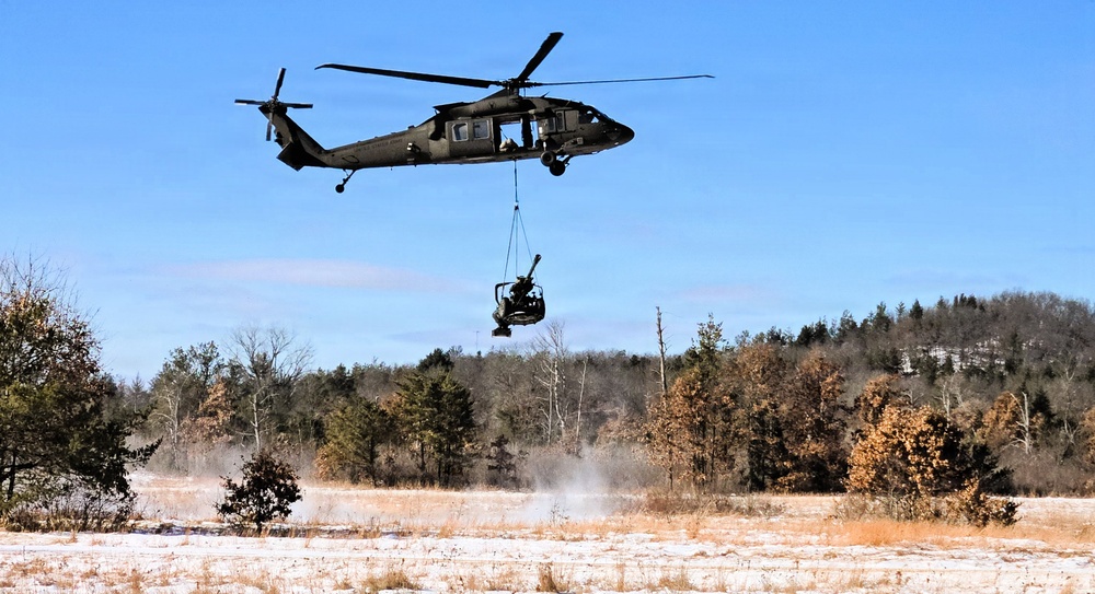 120th Field Artillery Soldiers conduct winter sling-load ops with Black Hawk, Chinook helicopters