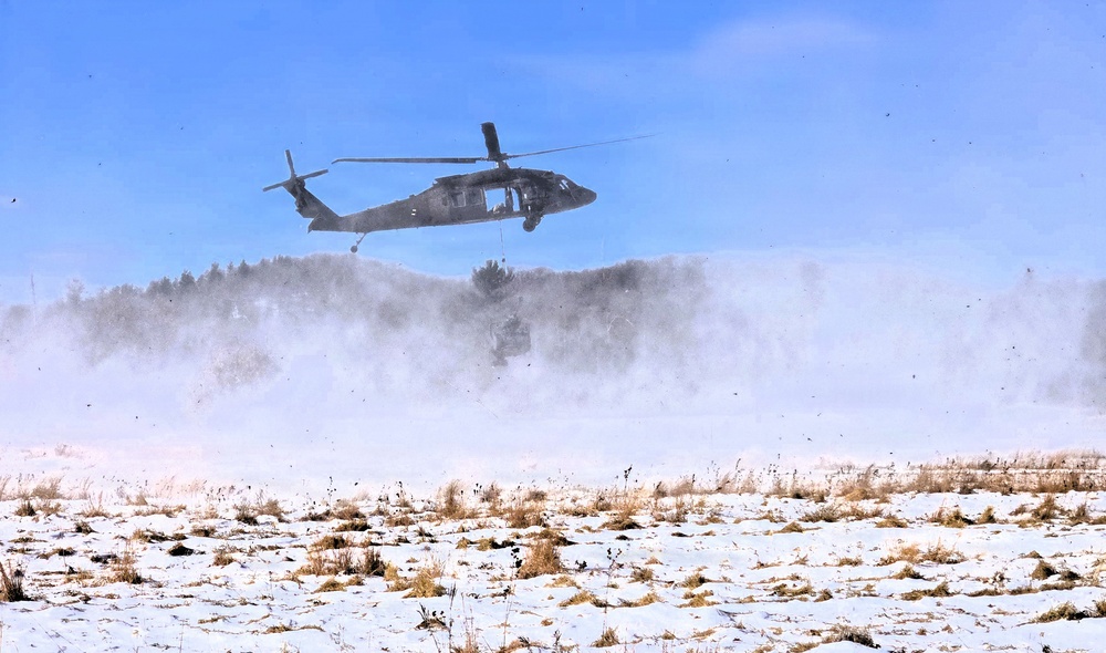 120th Field Artillery Soldiers conduct winter sling-load ops with Black Hawk, Chinook helicopters