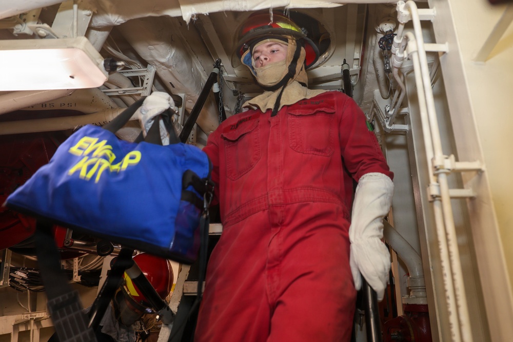 Sailors aboard the USS John Finn conduct a damage control drill in the South China Sea