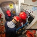 Sailors aboard the USS John Finn conduct a damage control drill in the South China Sea