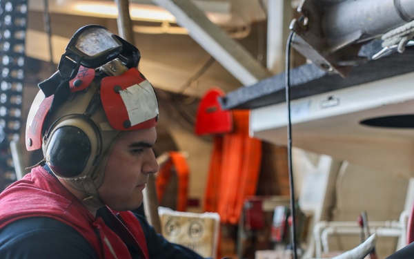Sailors aboard the USS John Finn conduct a crash and salvage drill in the South China Sea