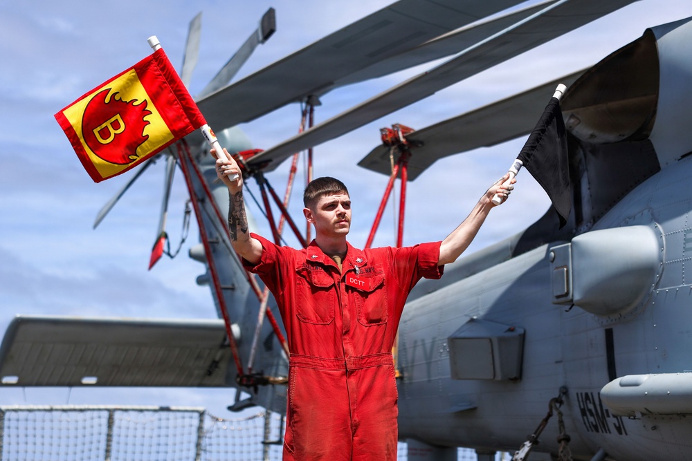 Sailors aboard the USS John Finn conduct a crash and salvage drill in the South China Sea
