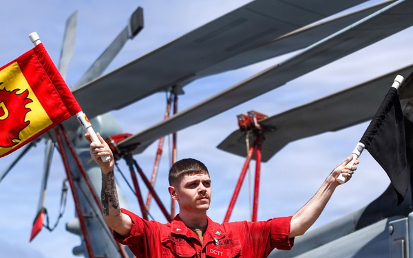 Sailors aboard the USS John Finn conduct a crash and salvage drill in the South China Sea