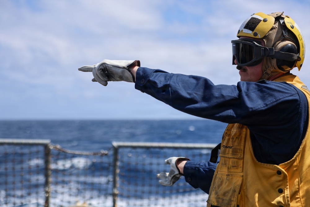Sailors aboard the USS John Finn conduct a crash and salvage drill in the South China Sea