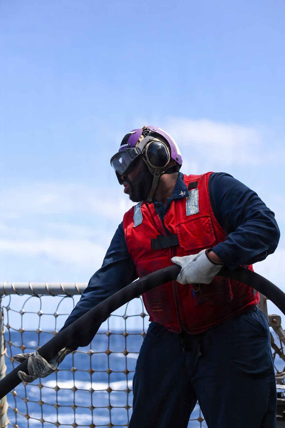 Sailors aboard the USS John Finn conduct a crash and salvage drill in the South China Sea