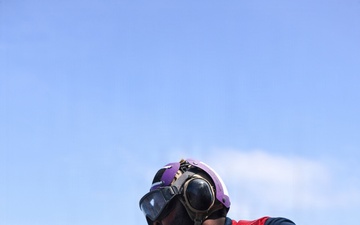 Sailors aboard the USS John Finn conduct a crash and salvage drill in the South China Sea
