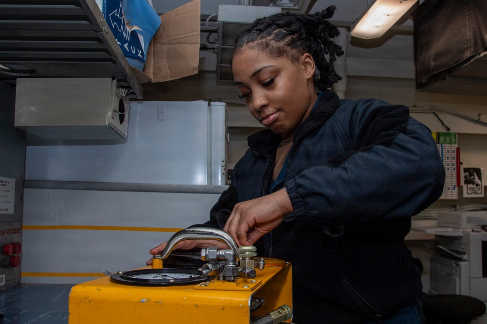 Abraham Lincoln conducts routine maintenance