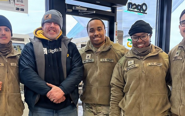 228th Theater Tactical Signal Brigade vehicle-recovery team assists a stranded vehicle during Winter Storm Gianna